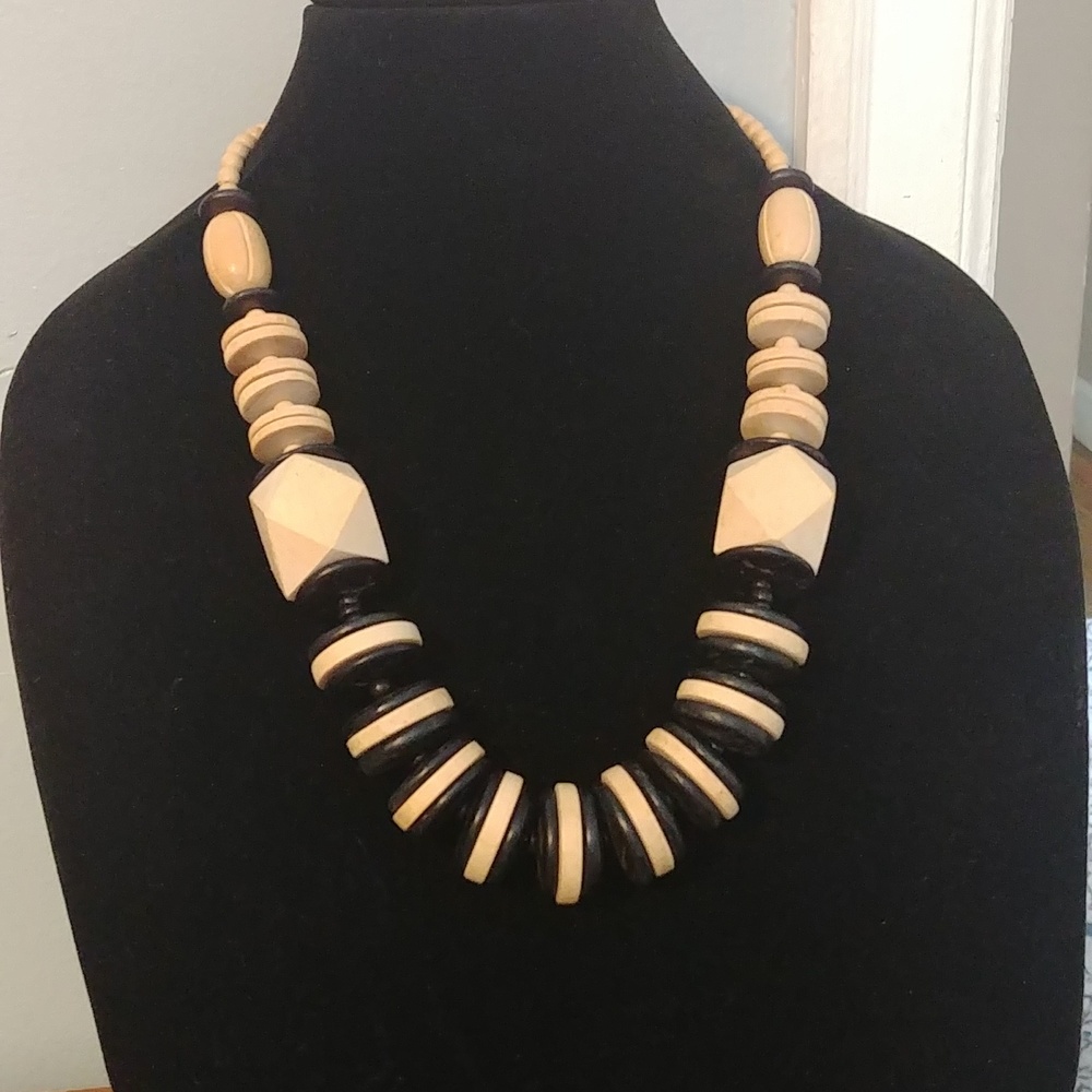 Black and tan colored 24 in wooden bead necklace.
